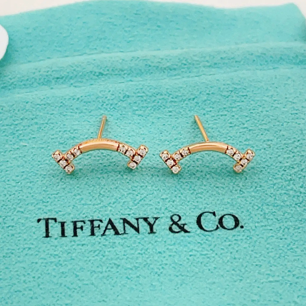 Tiffany & Co. rose gold diamond smiley face earrings